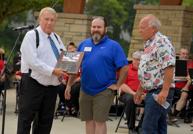 Batavia Mayor Jeff Schielke presents the 2023 Dr. Bernard Cigrand Patriot Award to Marty Callahan and Dave Brown during the annual Batavia Flag Day Ceremony on Wednesday, June 14, 2023.