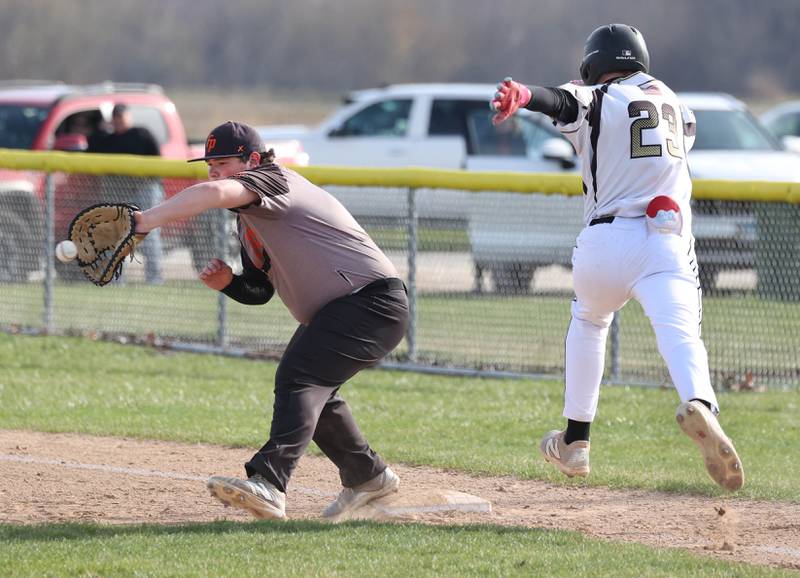 Sycamore's Noah Neece is out on a close play as Freeport's Chace Krzeminski catches the ball for the force out Tuesday, April 7, 2026, during their game at the Sycamore Community Sports Complex.