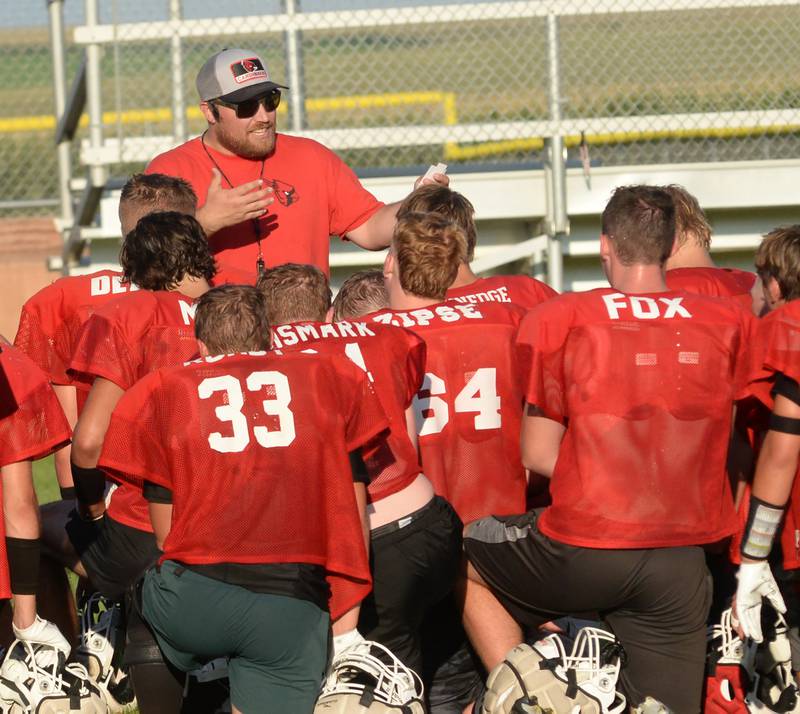 Forreston High School head coach Keynon Janicke talks to his players during practice on Wednesday, Aug. 13, 2025 in Forreston.