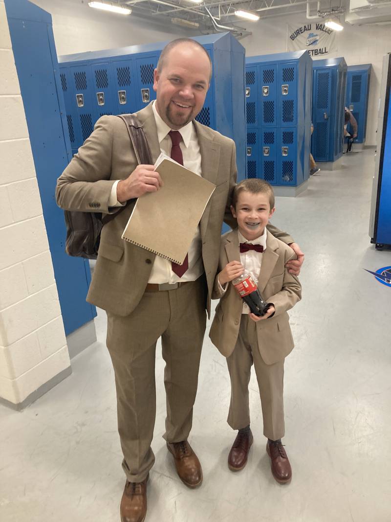 Bureau Valley boys  basketball coach Jason Marquis is joined by his look-a-like and son, Cal, in the Storm's locker room following a recent game. On occasion, Cal has been known to  play sports reporter in the locker room.