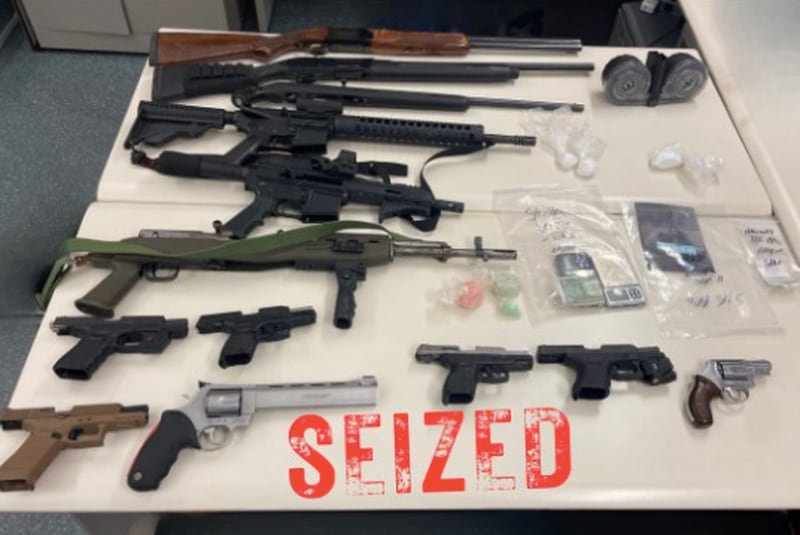 The Aurora Police Department posted an image of weapons seized during an investigation. Officers recovered 13 firearms, including AR-15 style rifles, a sawed-off rifle, shotguns and handguns.