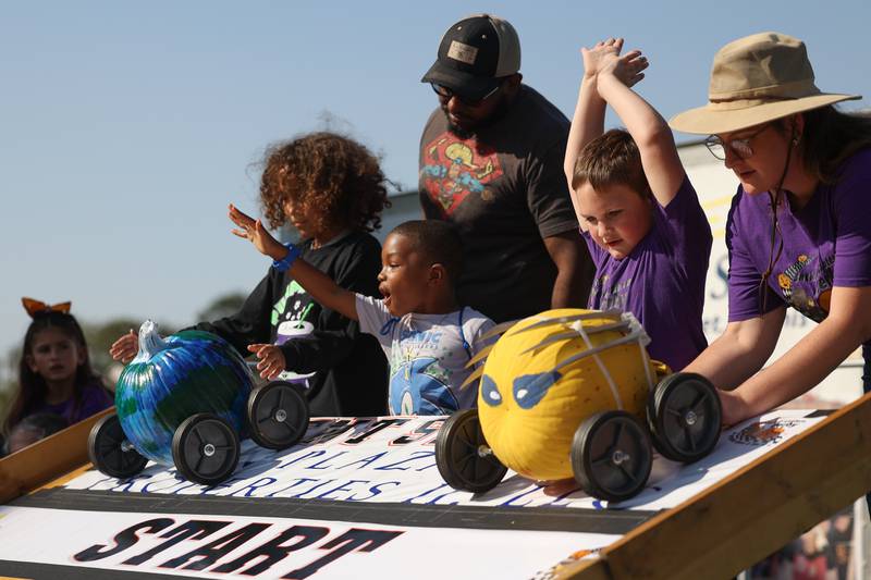Contestants race their pumpkins in the Pumpkin Derby at the Wish Upon a Star fundraiser on Saturday, Oct. 5, 2024 in Joliet.
