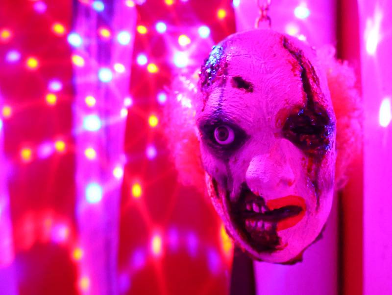 A clown face greets visitors to the clown room at the Insanity Haunted House at the Peru Mall on Monday Sep. 27, 2021.