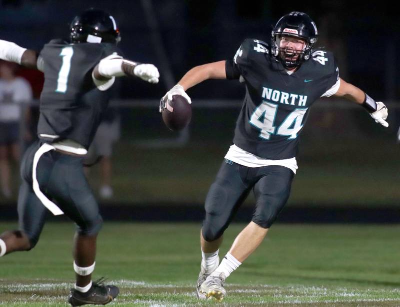 Woodstock North’s Brady Rogers, right, celebrates with JR Fadanunsi after a Rogers touchdown in varsity football at Rod Poppe Field on the campus of Marengo High School in Marengo on Friday, Sept. 12, 2025.
