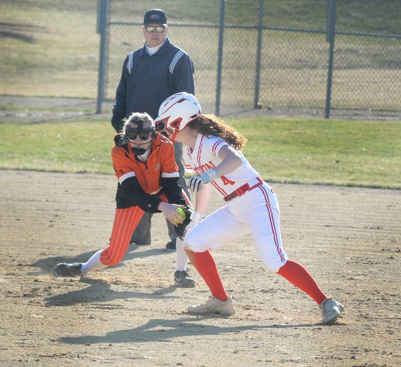 Milledgeville shortstop Annie Janssen fields a ground ball as Oregon's Ashlee Mundell runs to third base on Monday, March 23, 2026 at Oregon Park West.