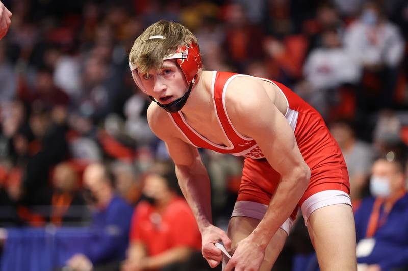 Hinsdale Central’s Cody Tavoso faces off against Prospect’s Will Baysingar in the Class 3A 132lb. semifinals at State Farm Center in Champaign. Friday, Feb. 18, 2022, in Champaign.