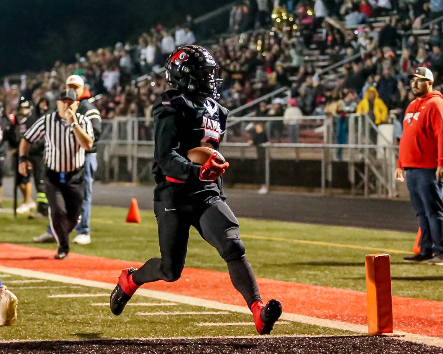 Glenbard East's Amonte Cook (5) runs in a touchdown during football game between Glenbard South at Glenbard East.   Oct 13, 2023.