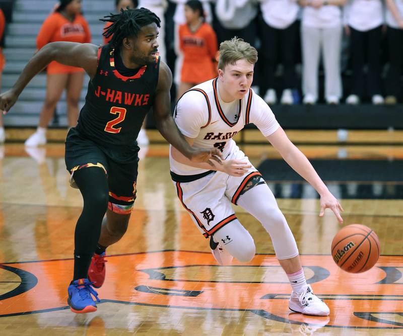 DeKalb’s Sean Reynolds pushes the ball up the court against Jefferson's Keyshon Stone Wednesday, Feb. 21, 2024, during their Class 4A regional semifinal game at DeKalb High School.