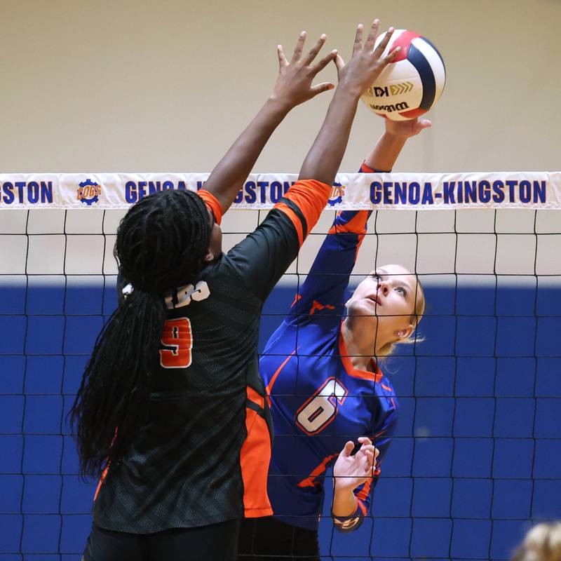 Genoa-Kingston's Addy Vicary (right) and DeKalb's Jordan Grant meet at the net Wednesday, Sept. 11, 2024, during their game at Genoa-Kingston High School.