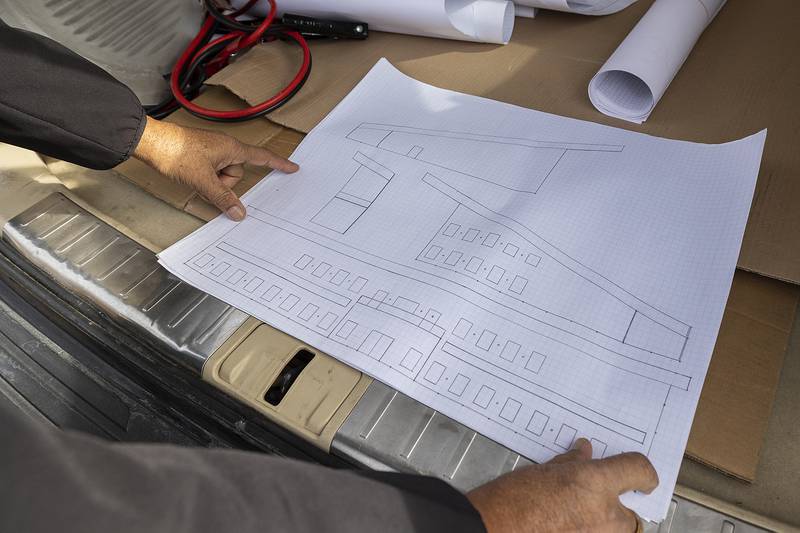 Sanjay Desai unveils drawings Tuesday, Feb. 4, 2025, of a building he plans to construct on a property adjacent to the Sublette Saloon. The plans for this facility run in conjunction for a fun center on Route 52.