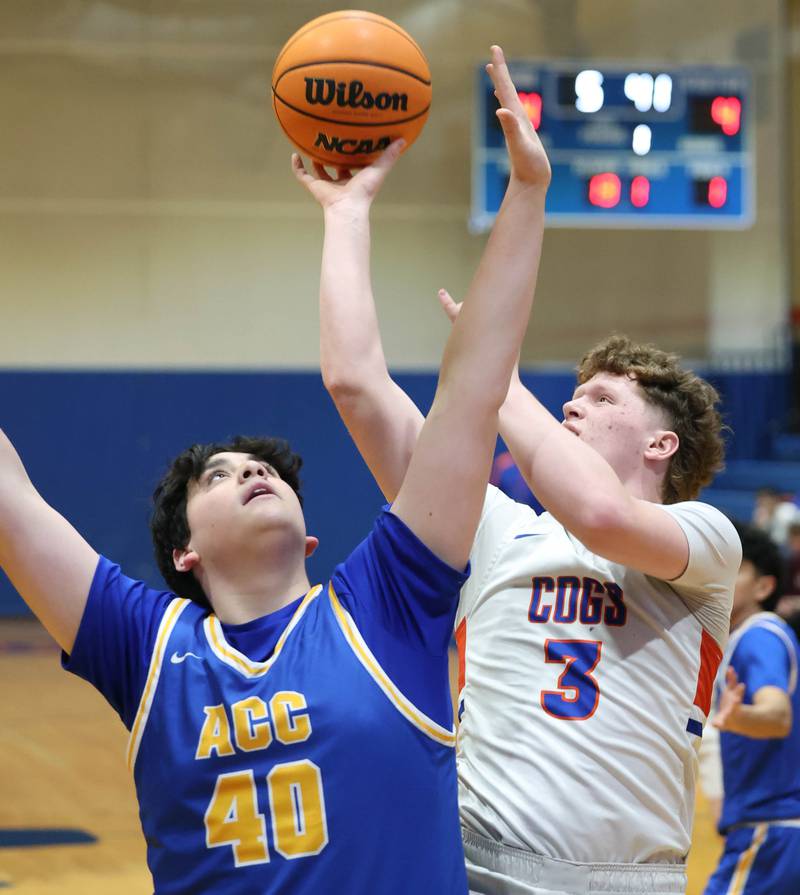 Genoa-Kingston's Jack Peterson shoots over Aurora Central Catholic's Braden Dillon Monday, Feb. 23, 2026, during their IHSA Class 2A regional quarterfinal at Genoa-Kingston High School.