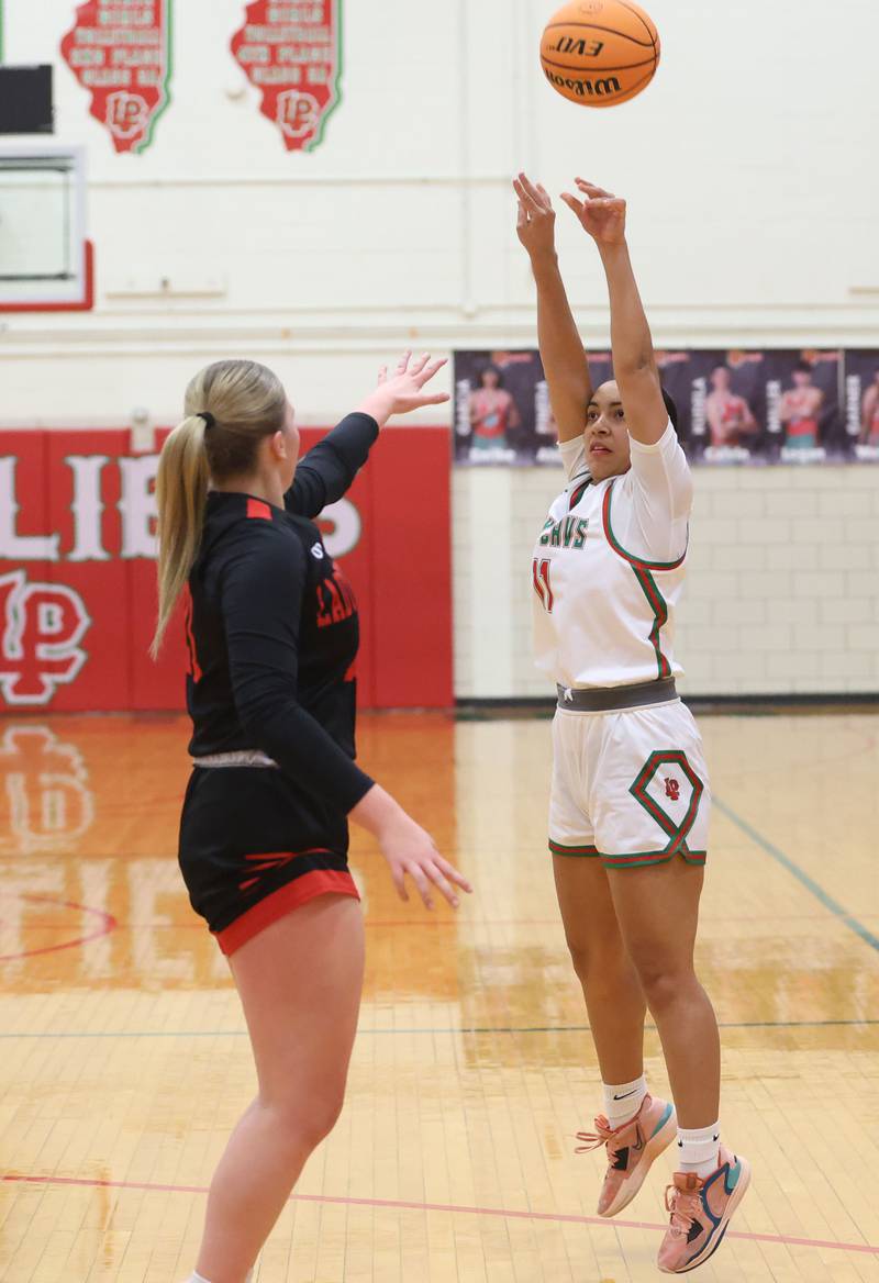 L-P's Giavanna Grebner shoots a jump shot over Hall's Caroline Morris on Monday, Jan. 12, 2026 in Sellett Gymnasium at L-P High School.