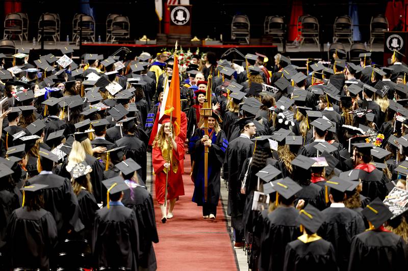 Northern Illinois University undergraduate students participate in a procession during a May 13, 2023 Commencement ceremony at the NIU Convocation Center in DeKalb.