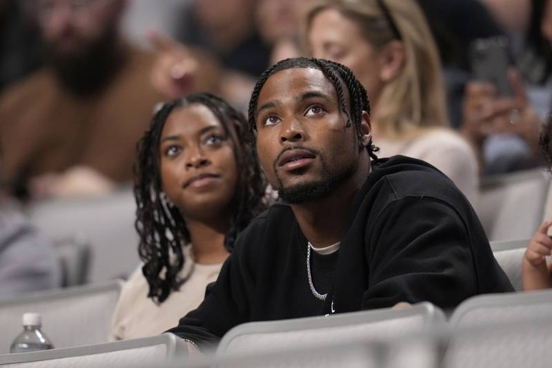 Jonathan Owens, the husband of Simone Biles watches as she competes on the balance beam during the U.S. Gymnastics Championships, Sunday, June 2, 2024, in Fort Worth, Texas. (AP Photo/Julio Cortez)