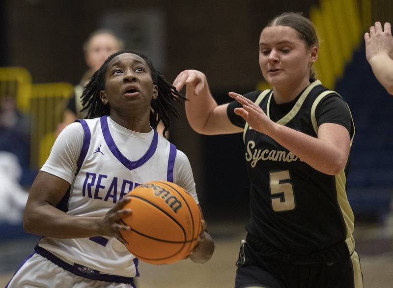 Plano’s Sanai Young looks to put up a shot against Sycamore’s Grace Amptmann Monday, Feb. 17, 2025, during a 3A semifinal in Sterling.