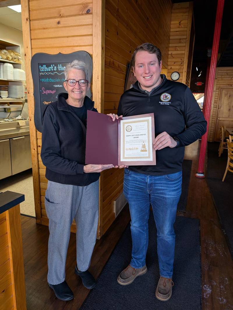 State Rep. Brad Fritts (right) presents Lynn Kenady of Happy Joe's Pizza and Ice Cream in Morrison with his Business Highlight Award for February.