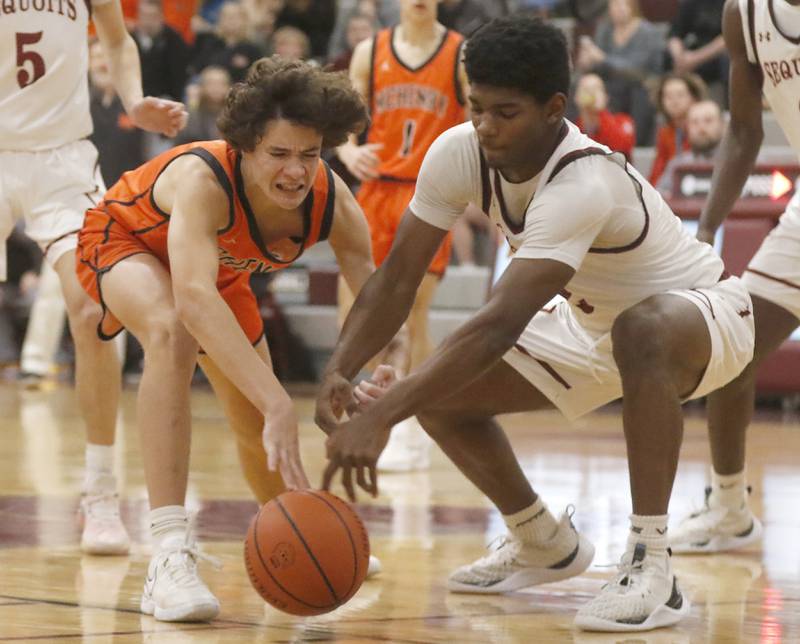 Huntley's Lucas Crosby and Antioch’s Teddi Wetu go after a loose ball during a nonconference basketball game Thursday, Jan. 4. 2024, at Antioch High School.