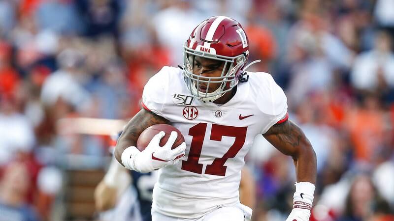 Alabama wide receiver Jaylen Waddle (17) carries the ball against Auburn during an NCAA college football game Saturday, Nov. 30, 2019, in Auburn, Ala. (AP Photo/Butch Dill)