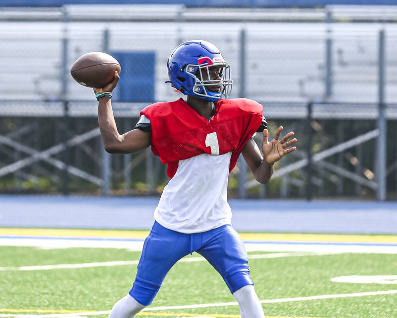 Jeffrey Woods passes during Joliet Central's joint practice with Thornton, July 31, 2025 in Joliet.