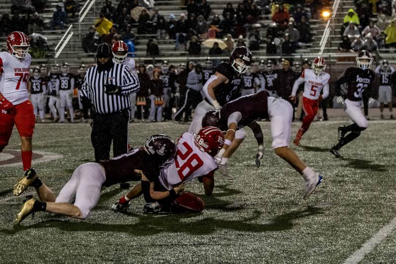 Lockport's Colton Benaitis tackles Homewood-Flossmoor's Kourtney Smith during an 8A varsity football playoff game at Lockport Township High School East Campus on Nov. 8, 2025.
