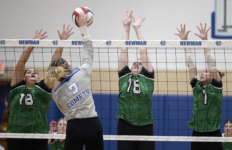 Rock Falls’ Ari Reyna (left), Taylor Segneri and Kacie Witherow work together to block a shot against Newman’s Makenzie Duhon Monday, Oct. 28, 2024, during regional play at Newman.