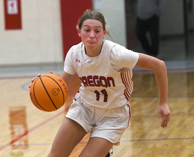 Oregon's Addison Rufer (11) drives to the basket against Aurora Christian  at the Oregon Girls Tip-Off Tournament on Friday, Nov. 21, 2025 at the Blackhawk Center in Oregon.