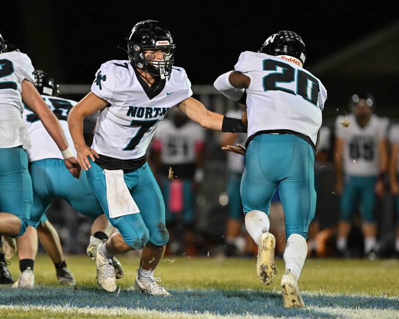 Woodstock North's Parker Halihan looks for an open receiver against Kishwaukee River Conference and crosstown rival Woodstock on Friday, Oct. 25, 2024 at Woodstock H.S.