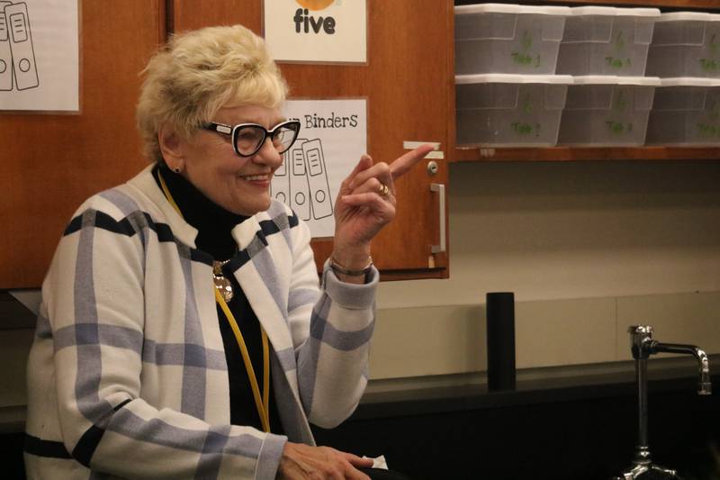 Barb Higgins, the wife of Vietnam War veteran Edward Higgins, is seen chiming in on the discussion had on Monday, Nov. 10, 2025, with students from Clinton Rosette Middle School in DeKalb.