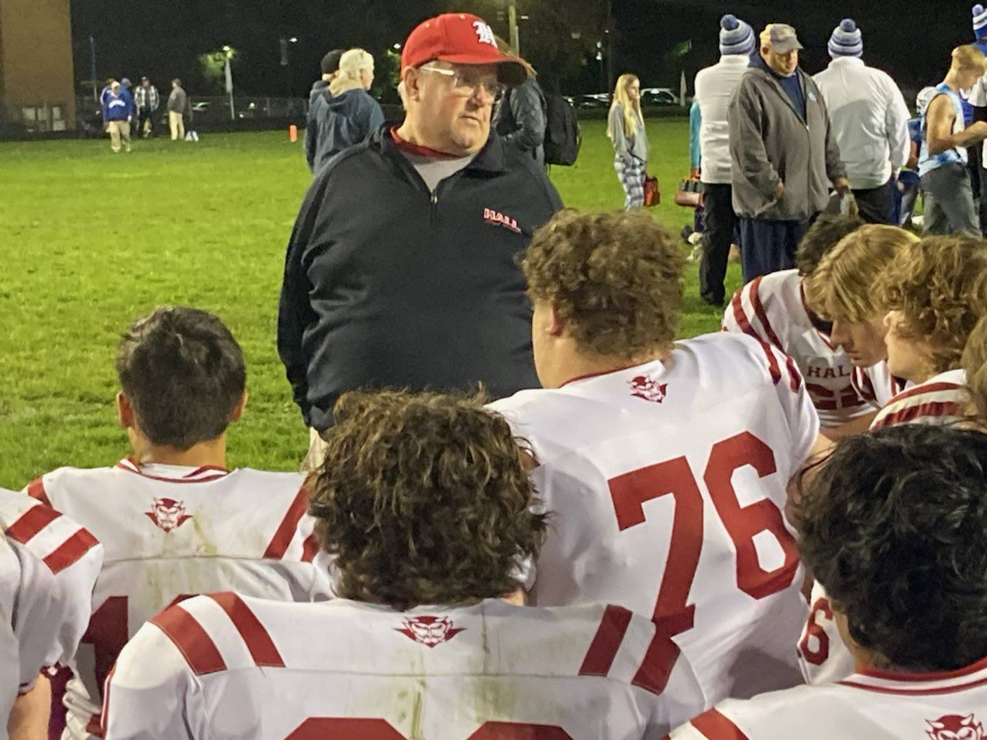 Hall coach Randy Tieman addresses the Red Devils following Friday's season-ending game at Princeton.