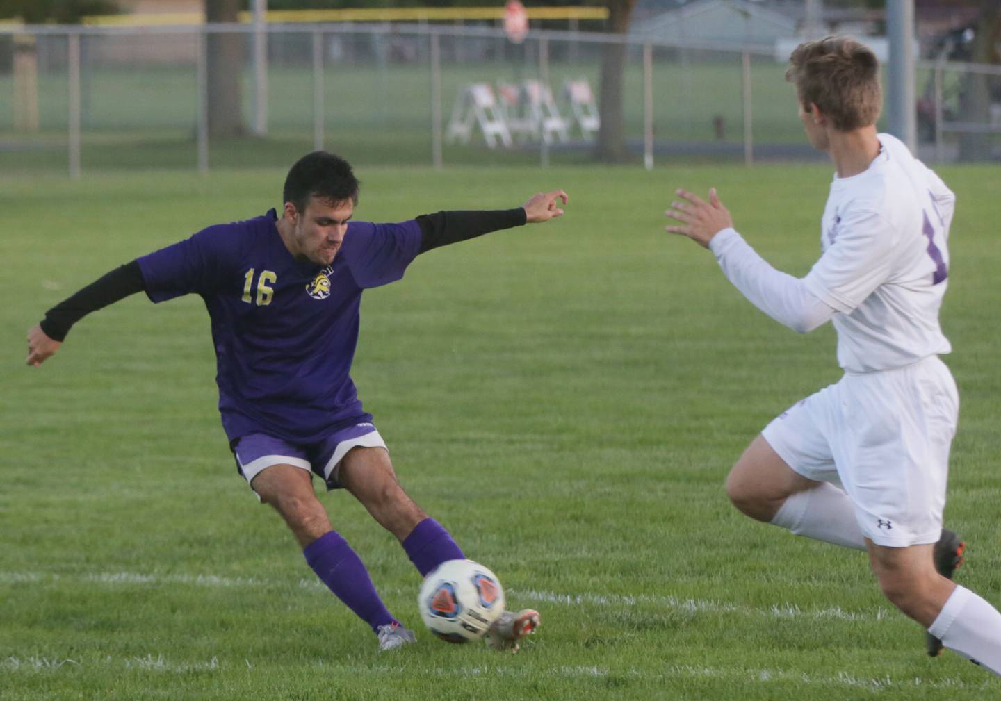 Mendota's Ricky Orozco (16) kicks the ball away from Peoria Christian's Caleb Forseth (18) in the Class 1A Sectional semifinal game in Chillicothe on Tuesday Oct. 19, 2021.