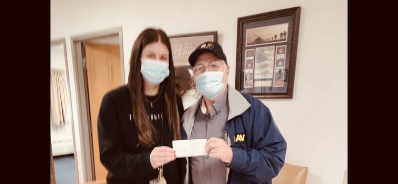 The Granville American Legion donated $1,500 from its poppy sales to the Illinois Veterans Home at La Salle for the purchase of exercise equipment. Pictured are (left) Bailie Bongartz, director of volunteer services, and Phil Euler, Granville American Legion finance officer.
