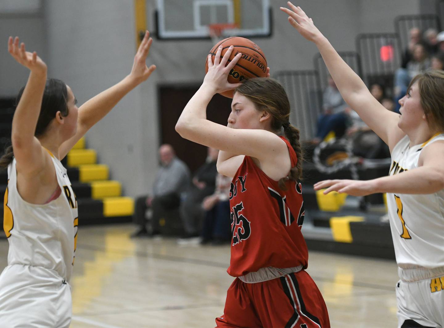 Amboy's Courtney Ortgiesen (25) looks to pass during a Feb. 7 game against AFC in Ashton.