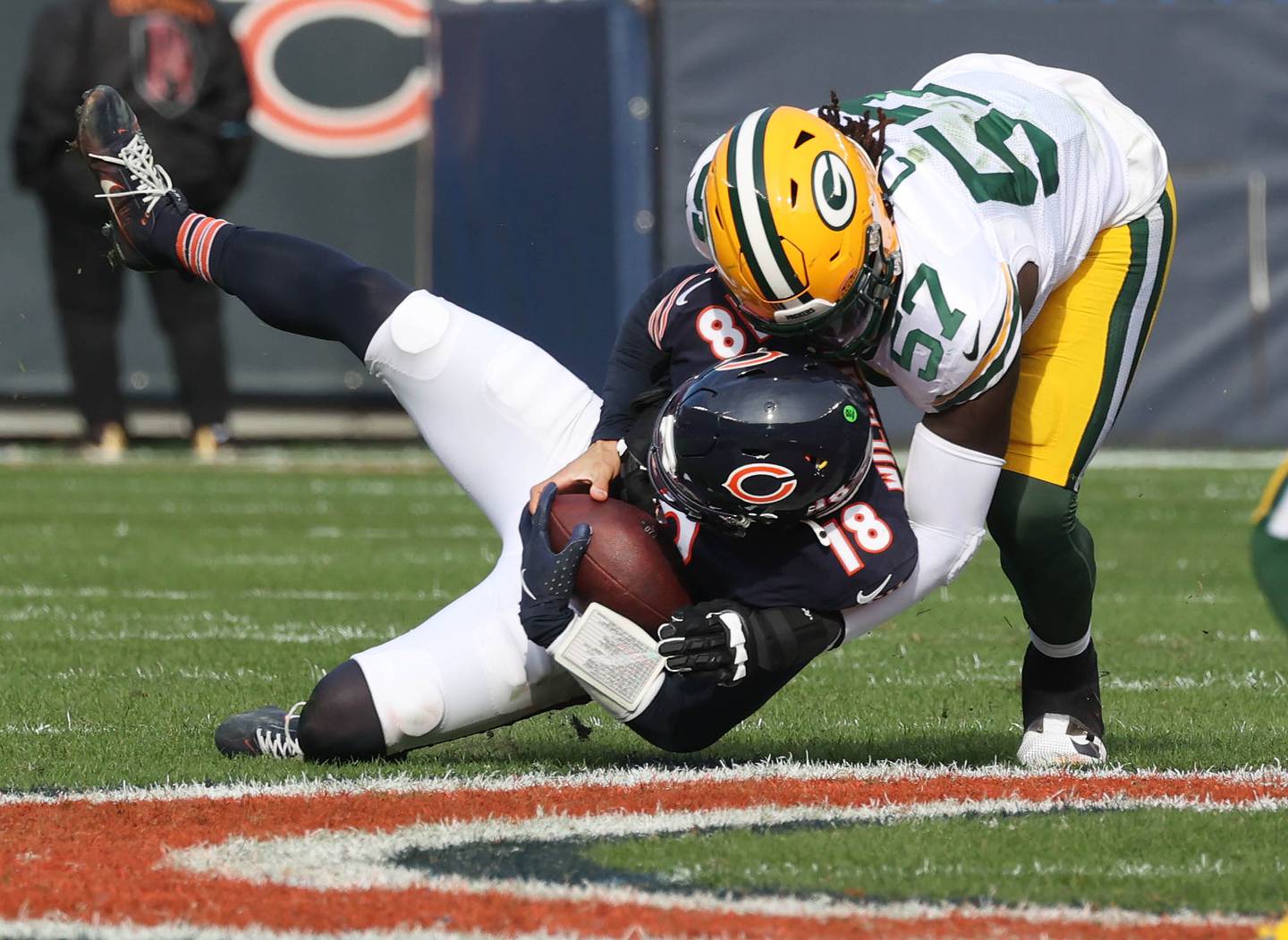 Chicago Bears quarterback Caleb Williams is sacked by Green Bay Packers defensive end Brenton Cox Jr. Sunday, Nov. 17, 2024, during their game at Soldier Field in Chicago.
