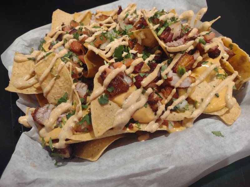 The loaded nachos at Brennan's Bar and Grill in Oglesby feature beer cheese sauce, chives, pico and boom sauce with chunks of pork.