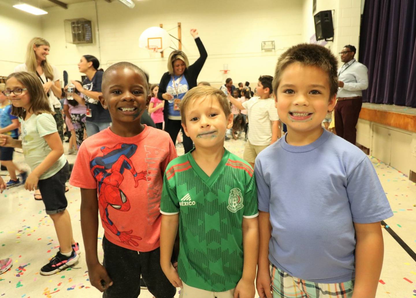Eisenhower Academy was named a 2022 National Blue Ribbon School on Friday, Sept. 16, 2022. Students and staff celebrated their achievements that same day with music, blue cupcakes and confetti. Pictured, from left, are Eisenhower students Carter Hines, Edwin Padilla and Edward Dinges.