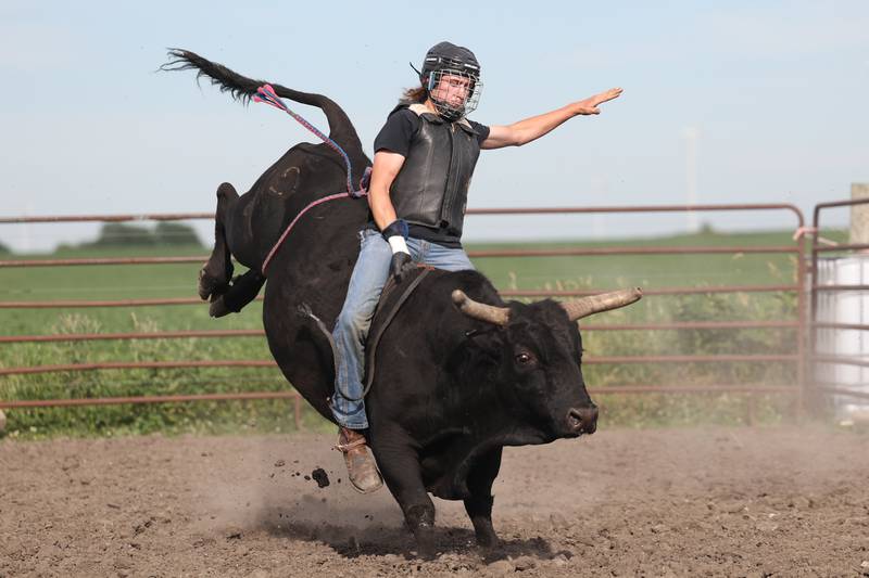 Dominic Dubberstine-Ellerbrock rides a bull during practice at Rugged Cross Cattle Company. Dominic will be competing in the 2022 National High School Finals Rodeo Bull Riding event on July 17th through the 23rd in Wyoming. Thursday, June 30, 2022 in Grand Ridge.