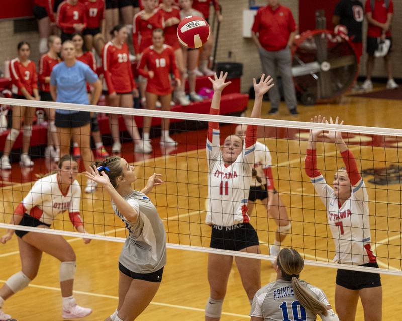 Keighley Davis (8) of Princeton jumps to hit volleyball over net to Ottawa's defense on Thursday, Sept. 18, 2025 at Ottawa High School in Ottawa.