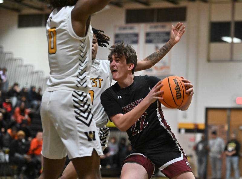 Plainfield North's Samuel Finn (22) drives to the basket during a conference game against Joliet West on Friday, Dec. 20, 2024, at Joliet.
