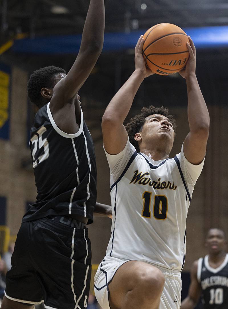 Sterling’s Koby Bell works against Galesburg’s Eden Mayala Tuesday, Feb. 10, 2026.