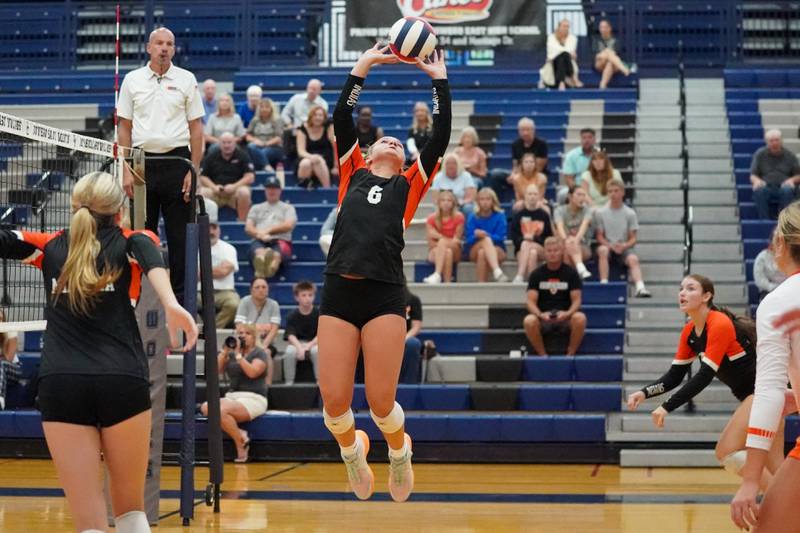 Minooka's Kendall Kozak (6) sets the ball against Oswego East during a Southwest Prairie Conference match in Oswego on Thursday, Sept. 18, 2025.