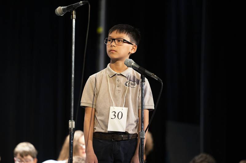 Sterling St. Mary School sixth grader William Dang appears on stage Thursday, March 9, 2023 during the Lee-Ogle-Whiteside Regional Spelling Bee.