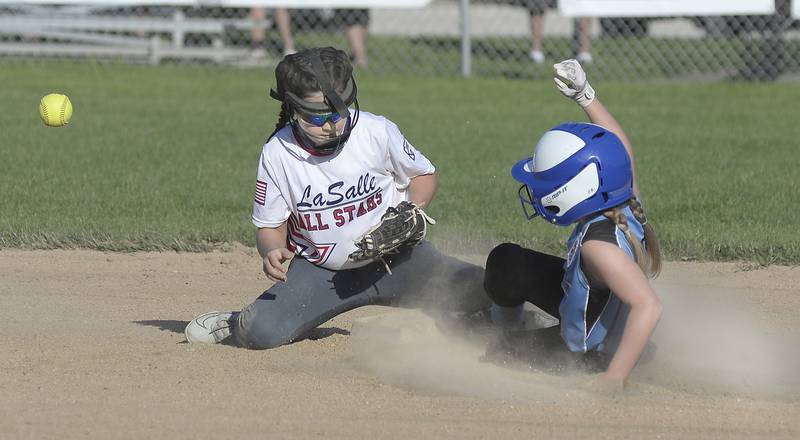 La Salle shortstop Mia Walker has the throw kicked away by Oglesby's Brynleigh Engel for a stolen base in Thursday's District 20 Minor League title game at La Salle.