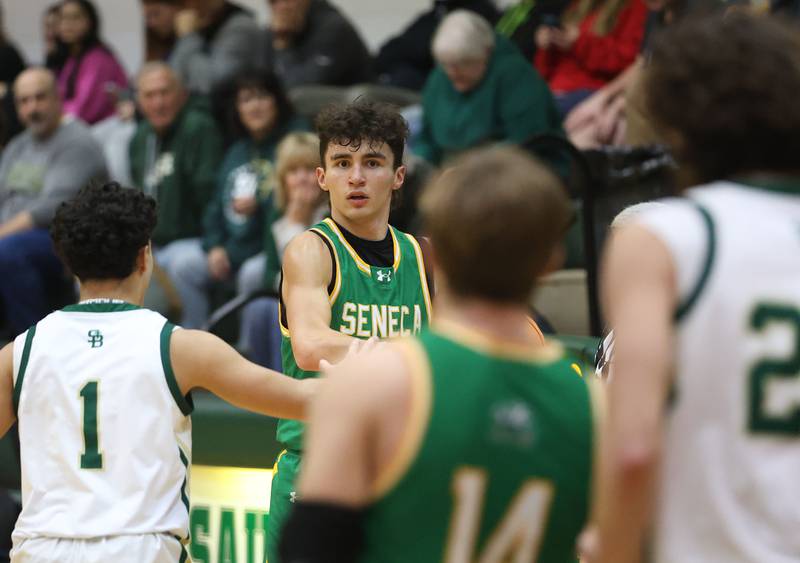 Seneca's Brayden Simek looks to pass the ball around St. Bede's Jose Delatorre on Tuesday, Dec. 16, 2025 at St. Bede Academy.