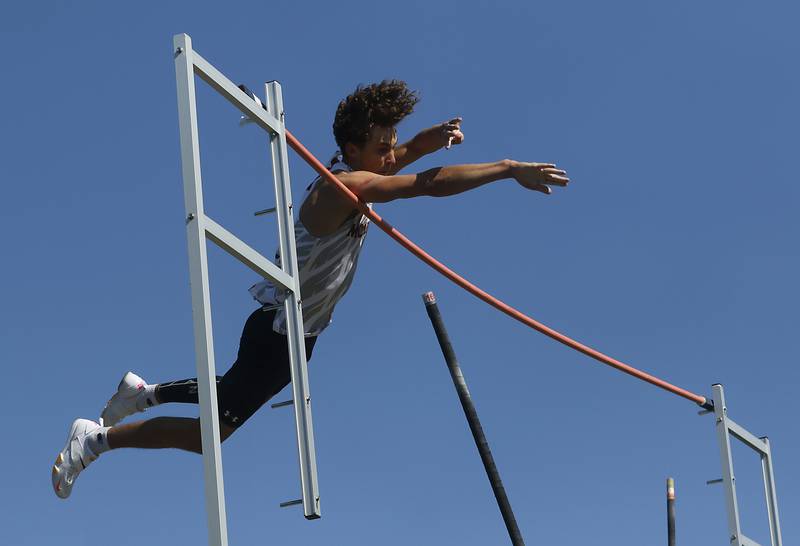 McHenry’s Zachary Galvicius pole vaults on Friday, April 19, 2024, during the McHenry County Track and Field Meet at Cary-Grove High School.