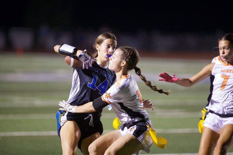 St. Charles East's Tessa Mallon looks to stop St. Charles North's Kaelie Tomalak on Monday, September 29, 2025 in St. Charles.
