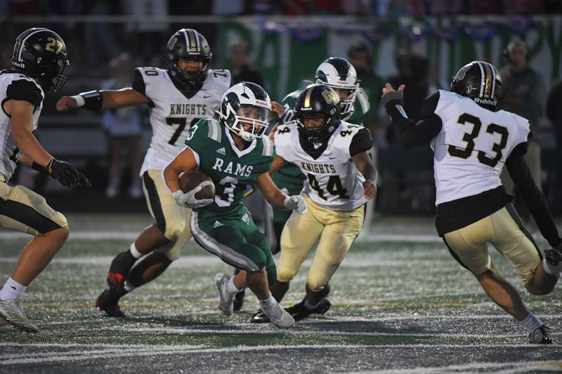 Grayslake Central’s Romeo Reyes is surrounded by Grayslake North players in a football game at Central High School on Thursday, September 14, 2023.