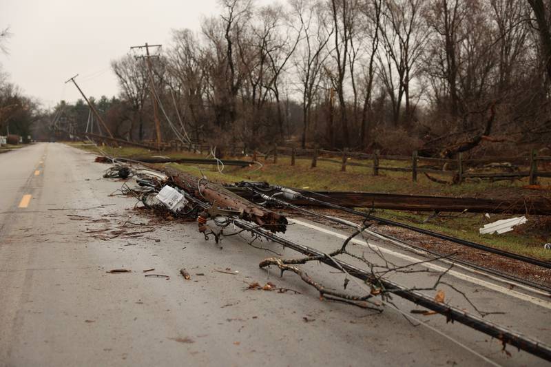 Downed power lines partially block Waldron Road in Aroma Park  on March 11, 2026 following a March 10 tornado that passed through Kankakee County.