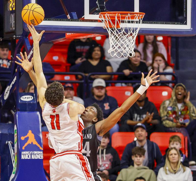 Deerfield's Jake Pollack (11) goes nose to nose with Kaneland's Jeffrey Hassan (34) during the IHSA Class 3A boys basketball state semifinal Friday, March 13, 2026 at the State Farm Center in Champaign.