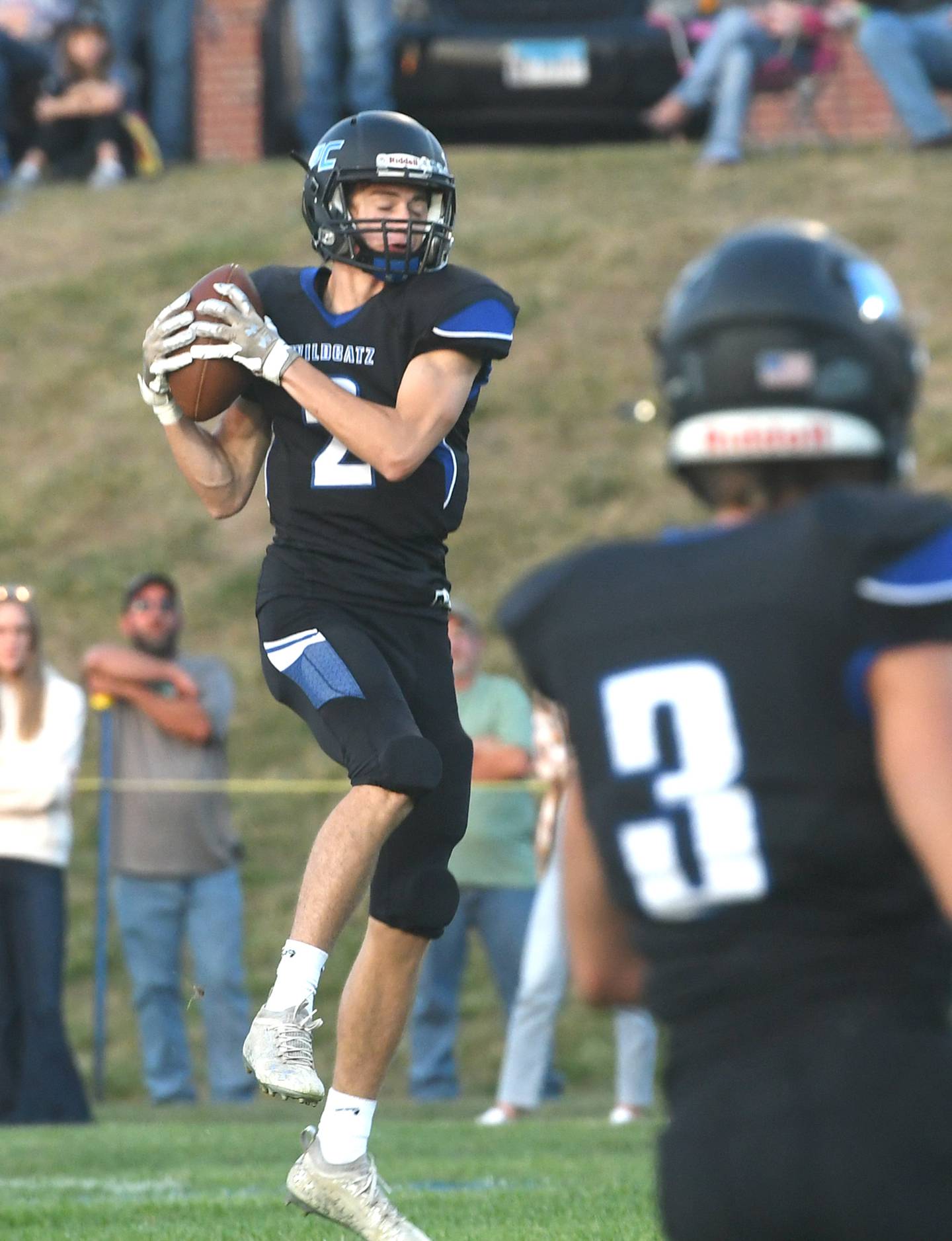 Eastland's Carsen Heeren catches a pass against Forreston.