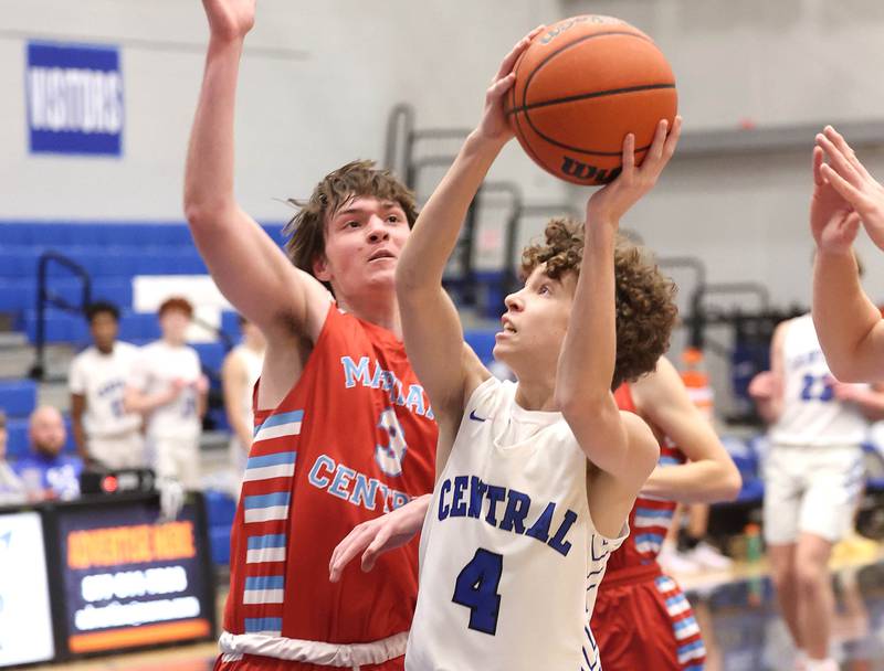 Burlington Central's Ryan Carpenter goes to the basket against Marian Central's Braedon Todd Monday, Jan. 15, 2023, during their game in the Burlington Central Martin Luther King Jr. boys basketball tournament.